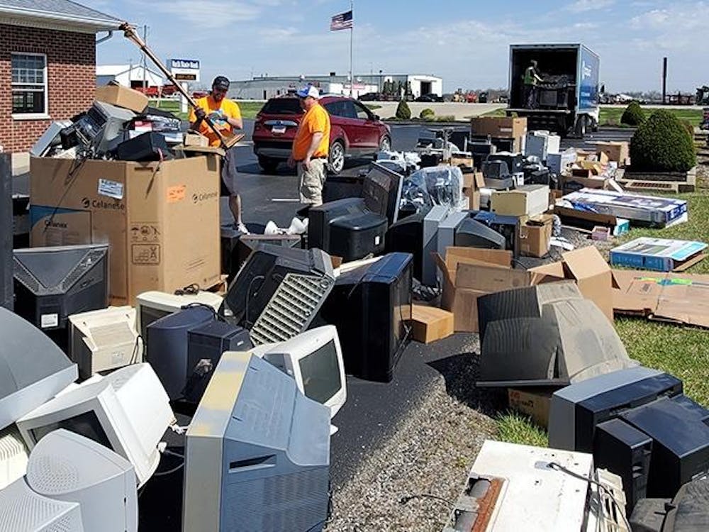Workers sort through electronic waste at Electronic Waste Recycle Day.