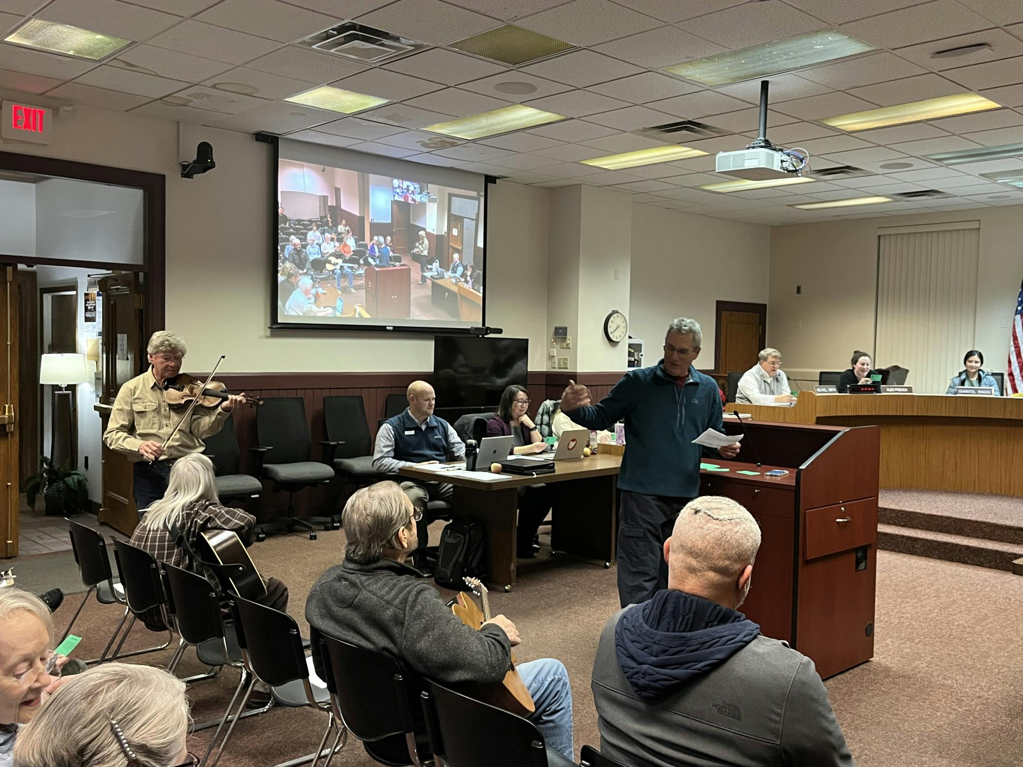 Counselors celebrate the success of the Oxford Farmers Market through song and dance at Tuesday’s city council meeting