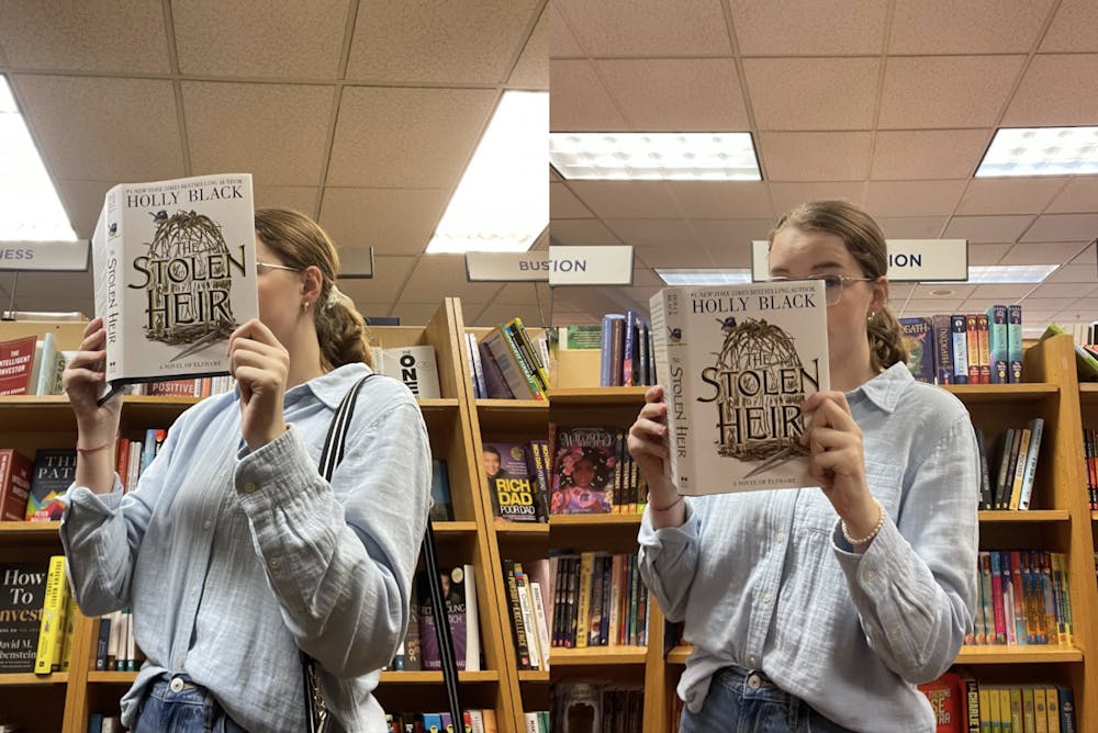 Staff Writer Lily Wahl, seen here enjoying the latest book from fiction writer Holly Black, is very happy with how "The Stolen Heir" turned out.