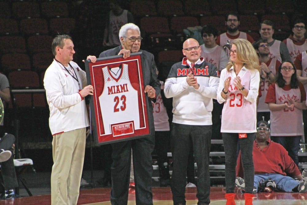 Wayne Embry (second from left) receives a framed jersey on &quot;Wayne Embry Day,&quot; Feb. 10, 2019, at Millett Hall.