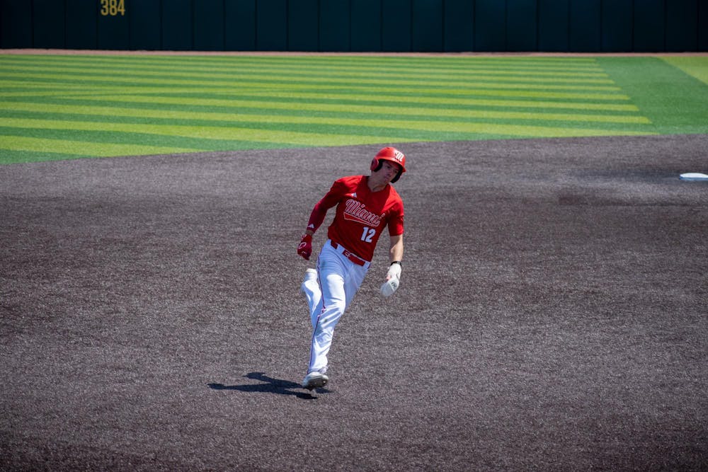 Junior outfielder Marcus Dierks runs into third during game against Ohio University.