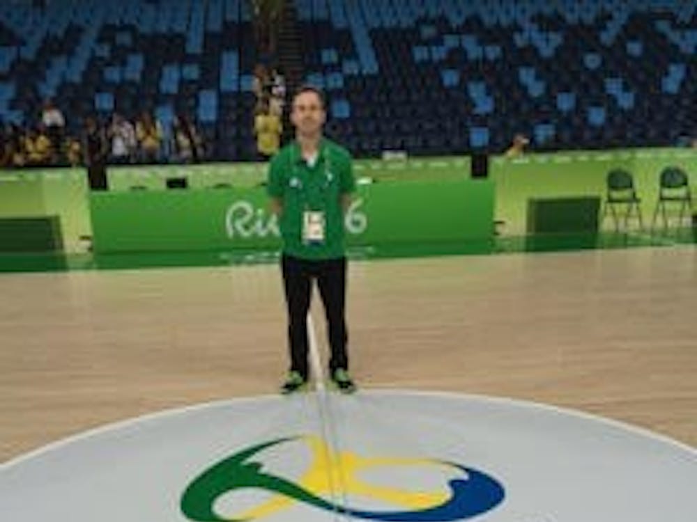 Chris Leazier, a Miami grad and the assistant coach of the Nigerian Olympic basketball team, stands on the court in Rio.