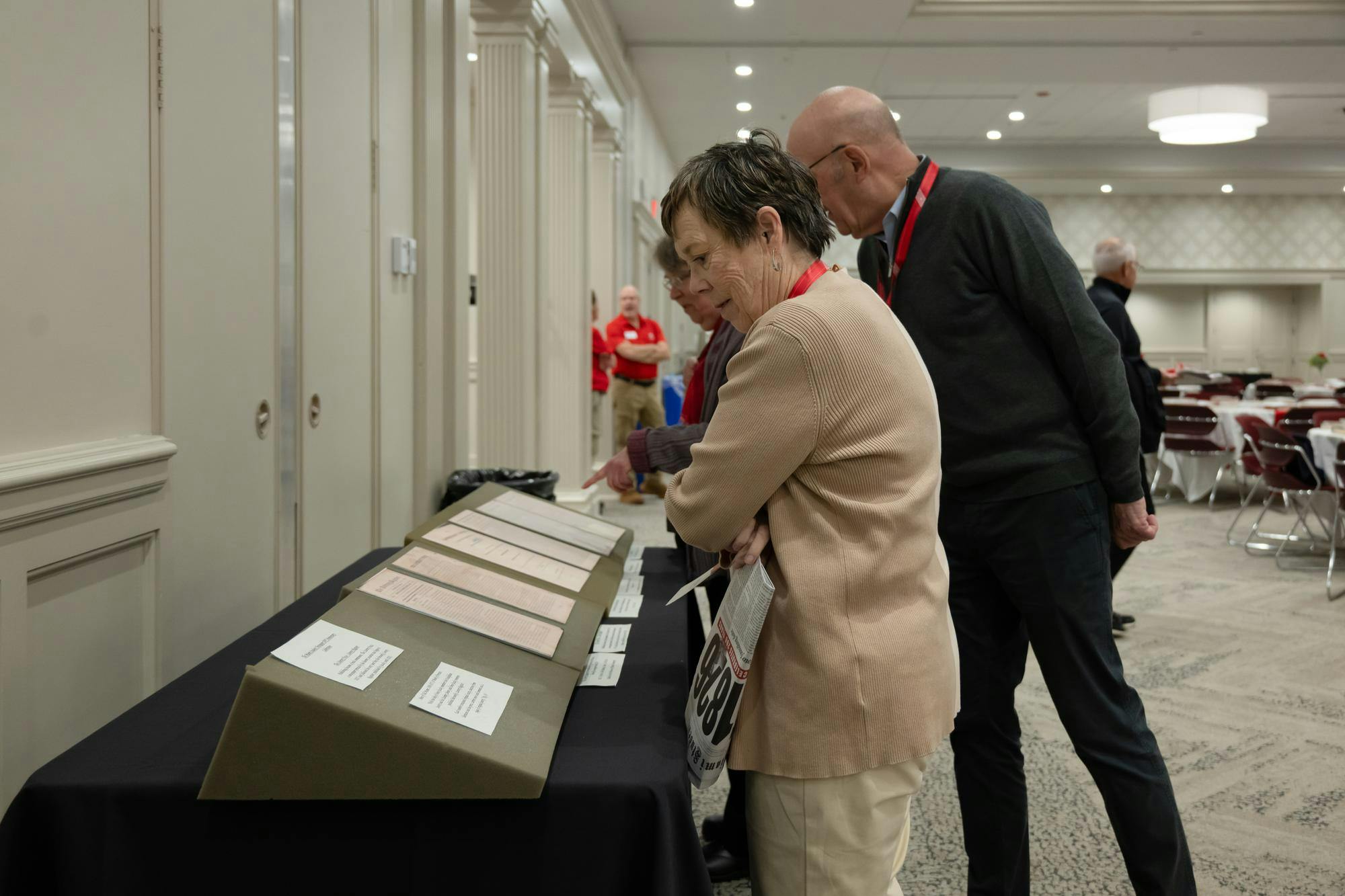 Alumni look over archived pieces from TMS history during the 200th anniversary weekend.