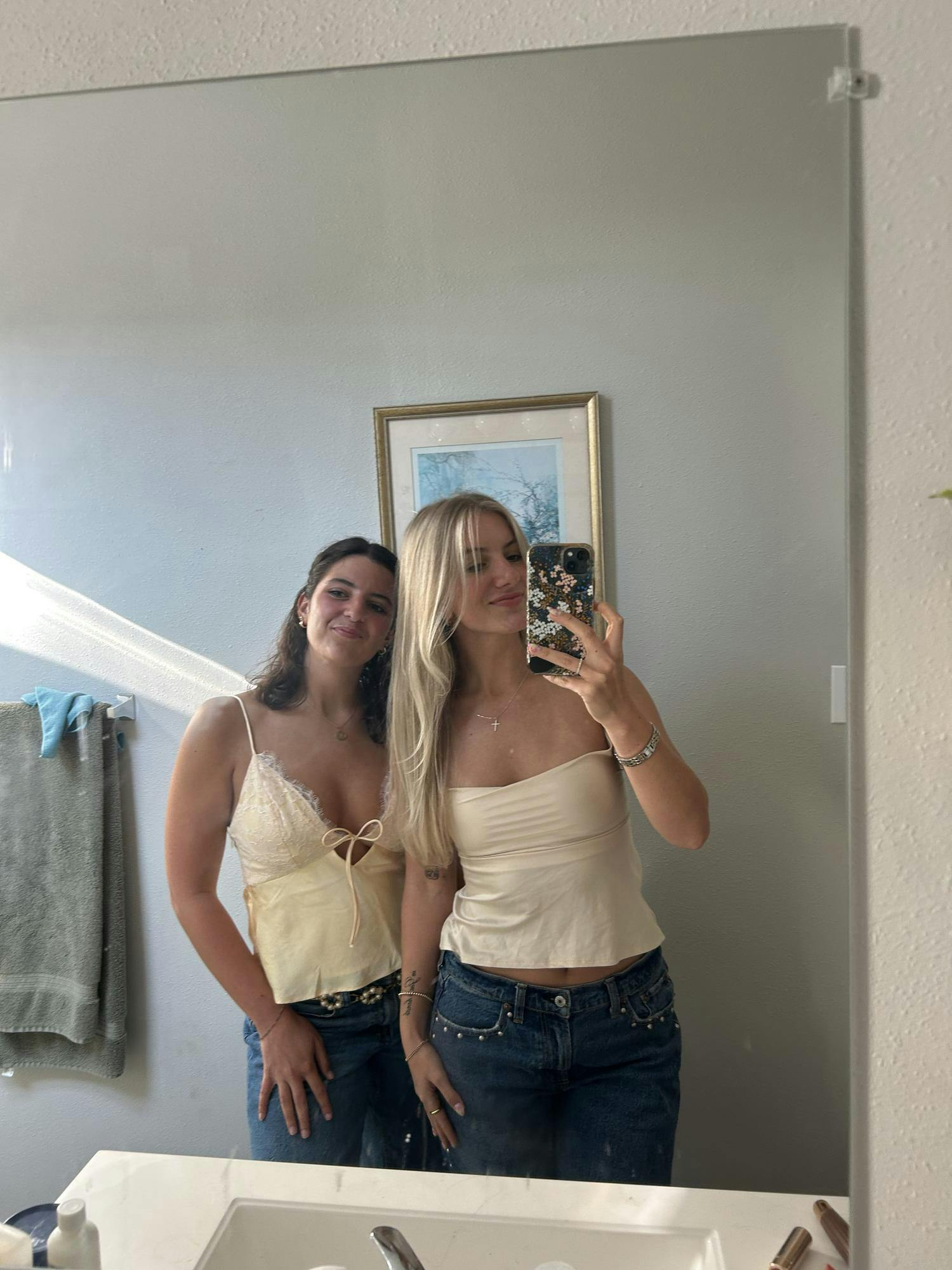 Olivia Michelsen (left) and Madeline Buecker (right) smile for a photo together. Photo provided by Olivia Michelsen