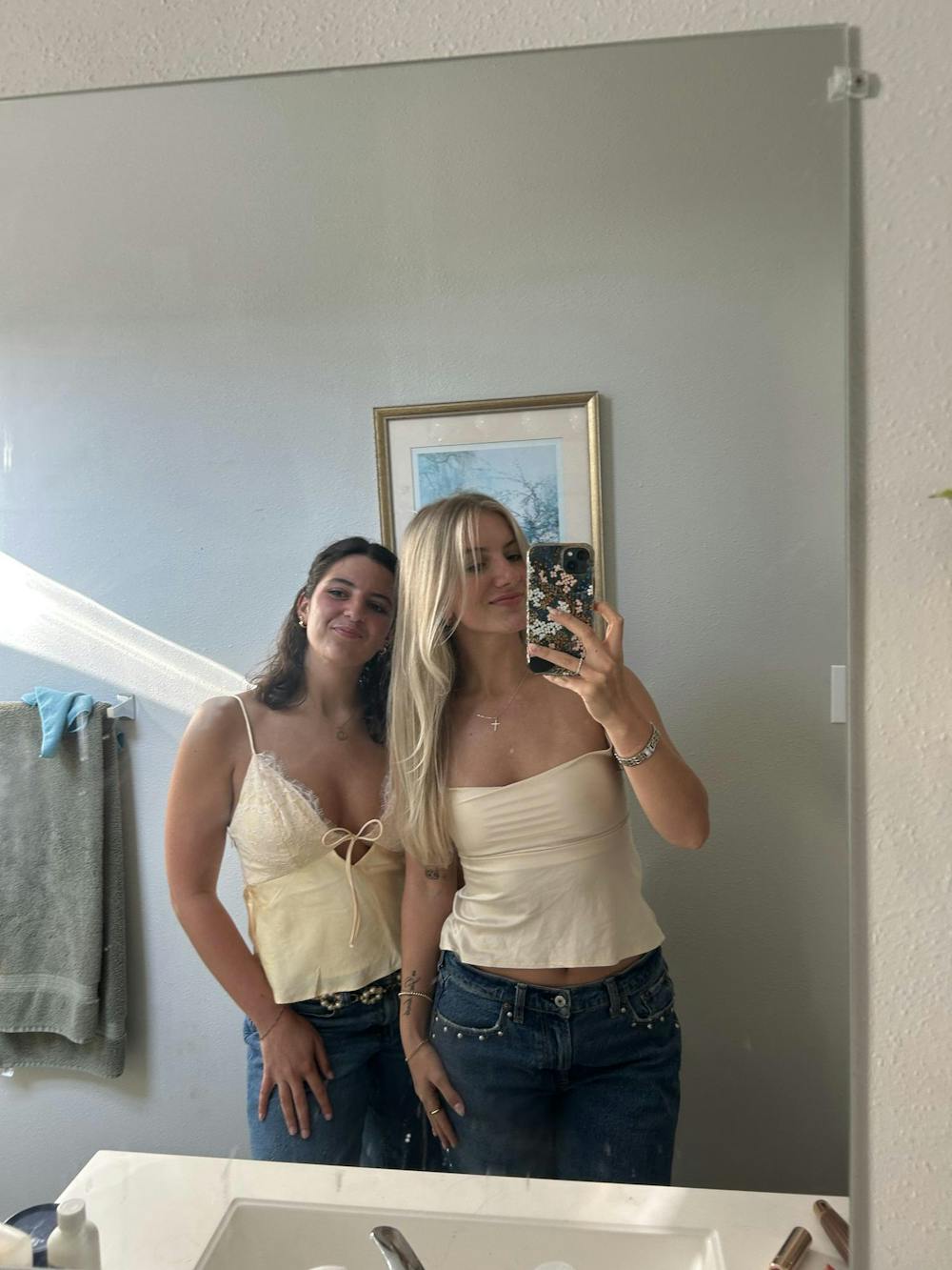 Olivia Michelsen (left) and Madeline Buecker (right) smile for a photo together. Photo provided by Olivia Michelsen