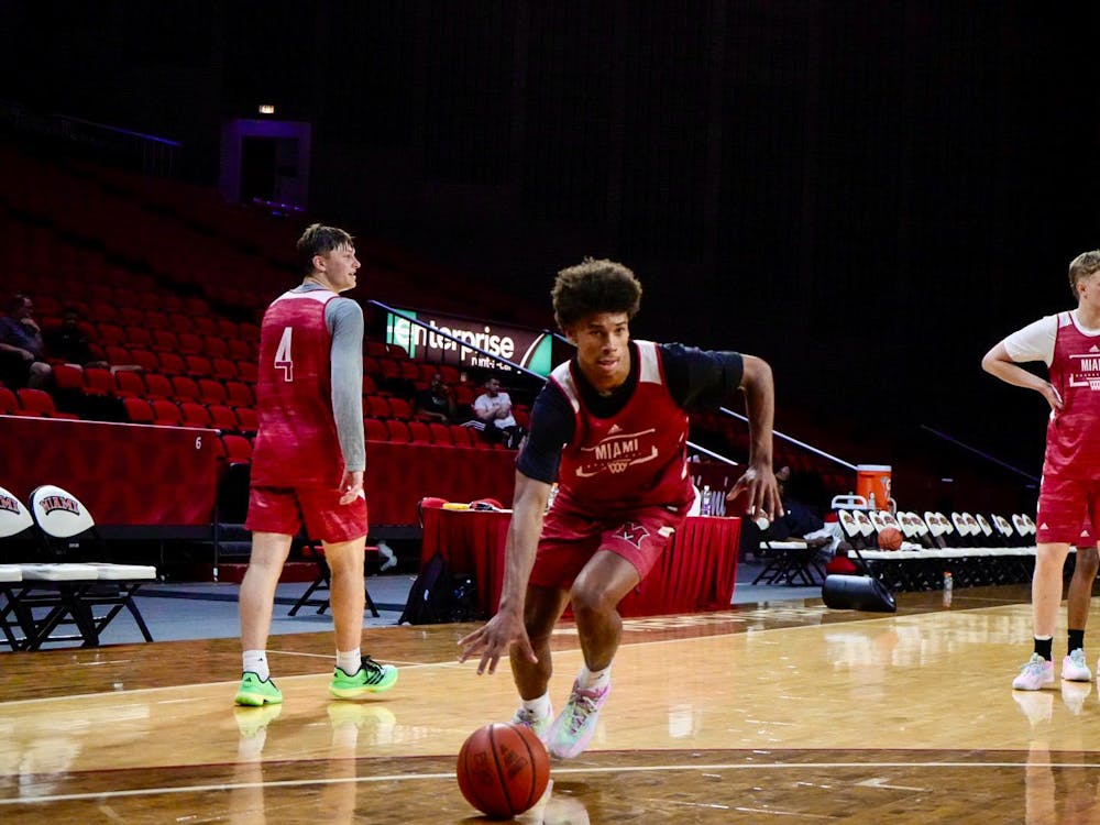 First-year guard Justin Kirby dribbles towards the basket at Millett Hall during a summer practice.