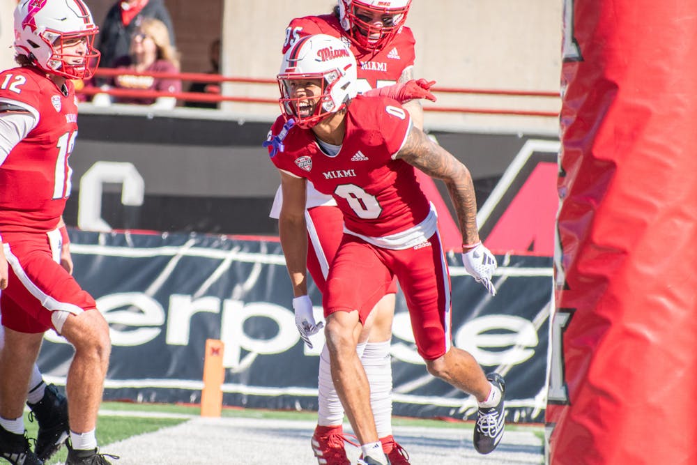 Receiver Reggie Virgil celebrating a touchdown pass from backup quarterback Henry Hesson in the second quarter against Central Michigan last week