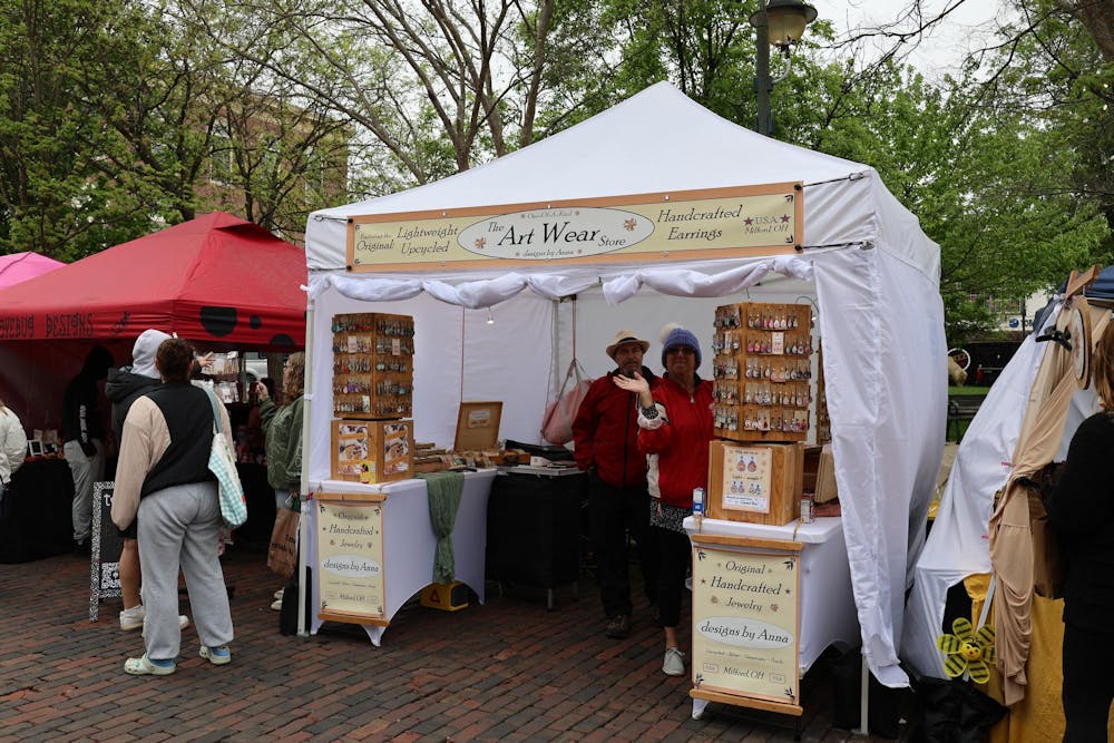 People gather around a tent