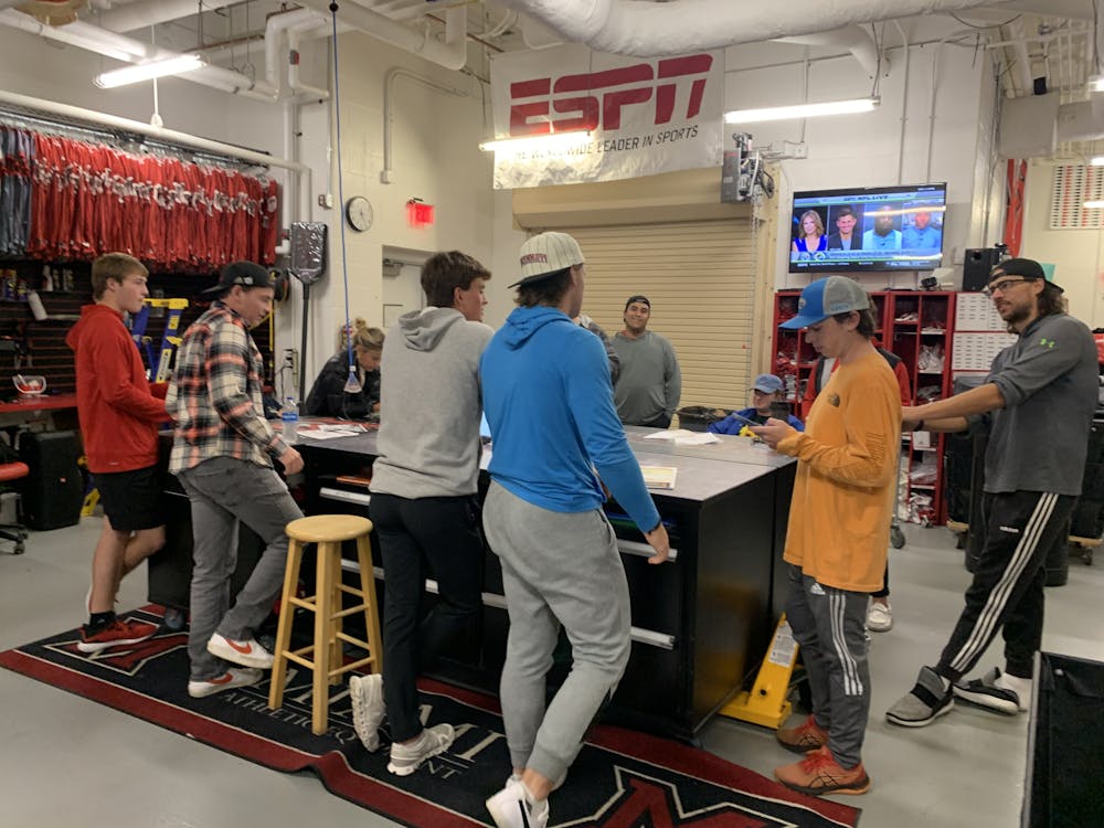 Miami football equipment coordinator Adam Boyer addresses his student team before a mad dash to set up the locker room for Miami’s game against Toledo. Photo by Jack Schmelzinger