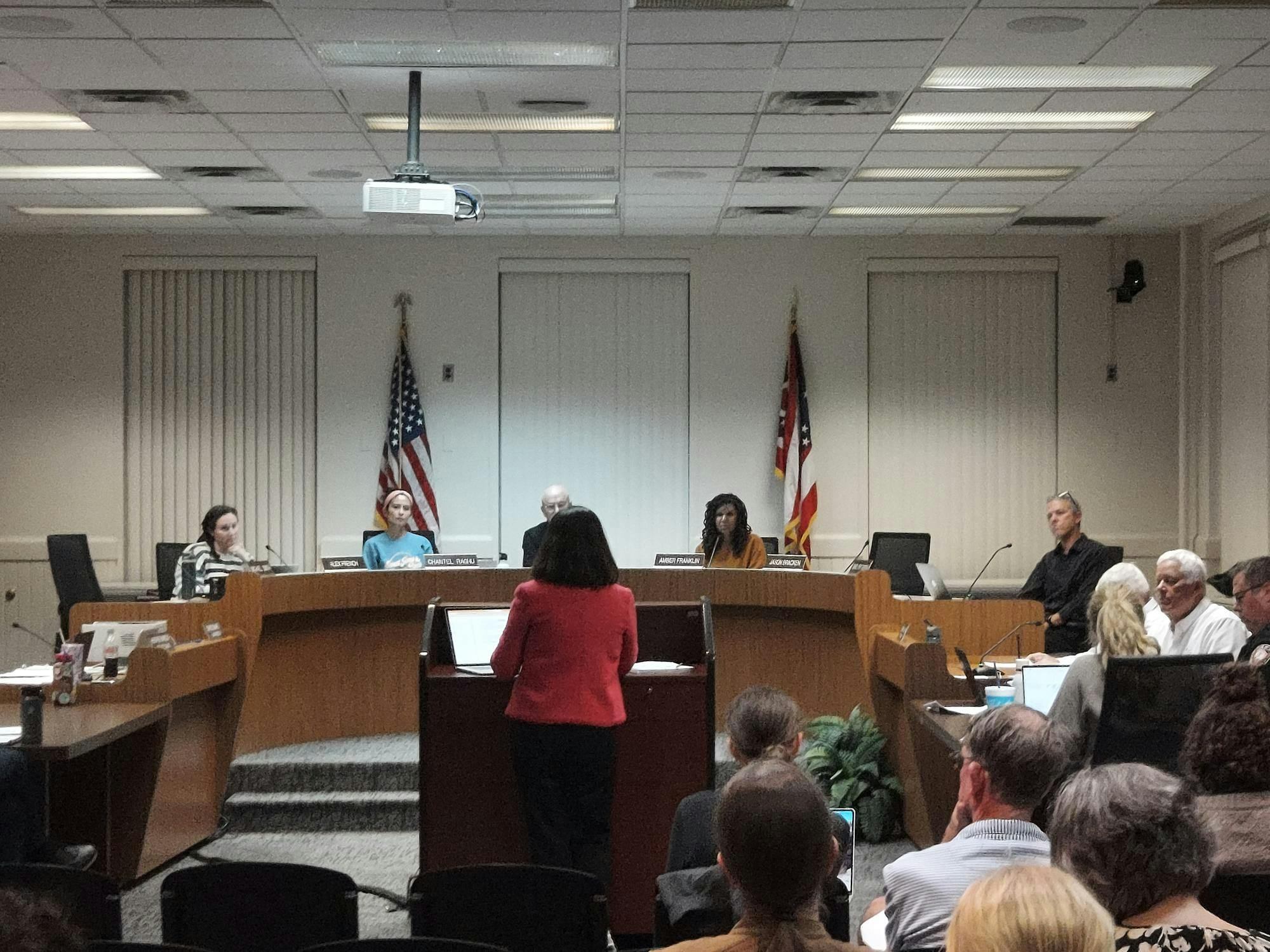 Assiant City manager Jessica Greene presents deer population control resolution to city council on Tuesday, Oct. 7.
