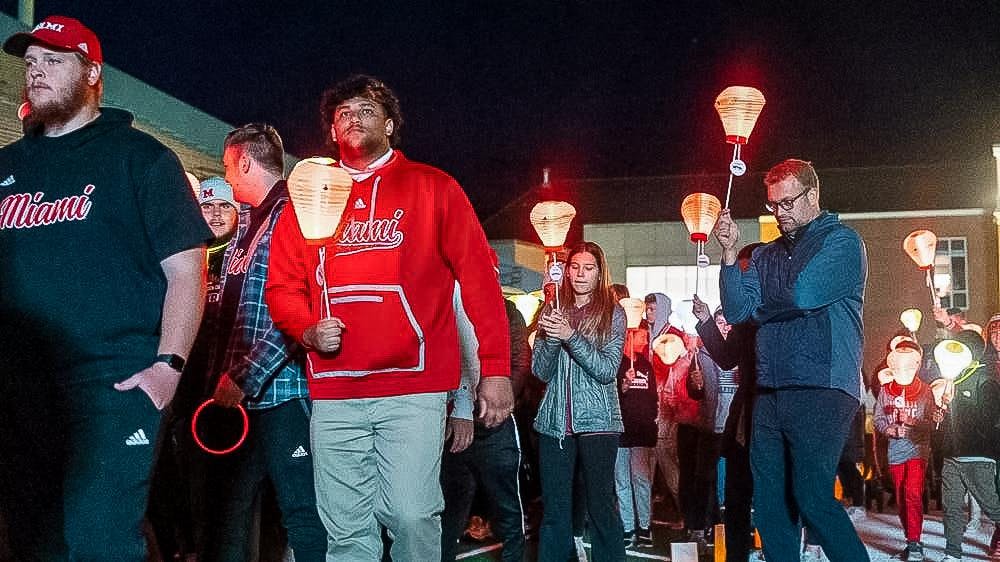 Attendees walking and carrying lanterns at last year's Light the Night. Photo provided by Miami Athletics