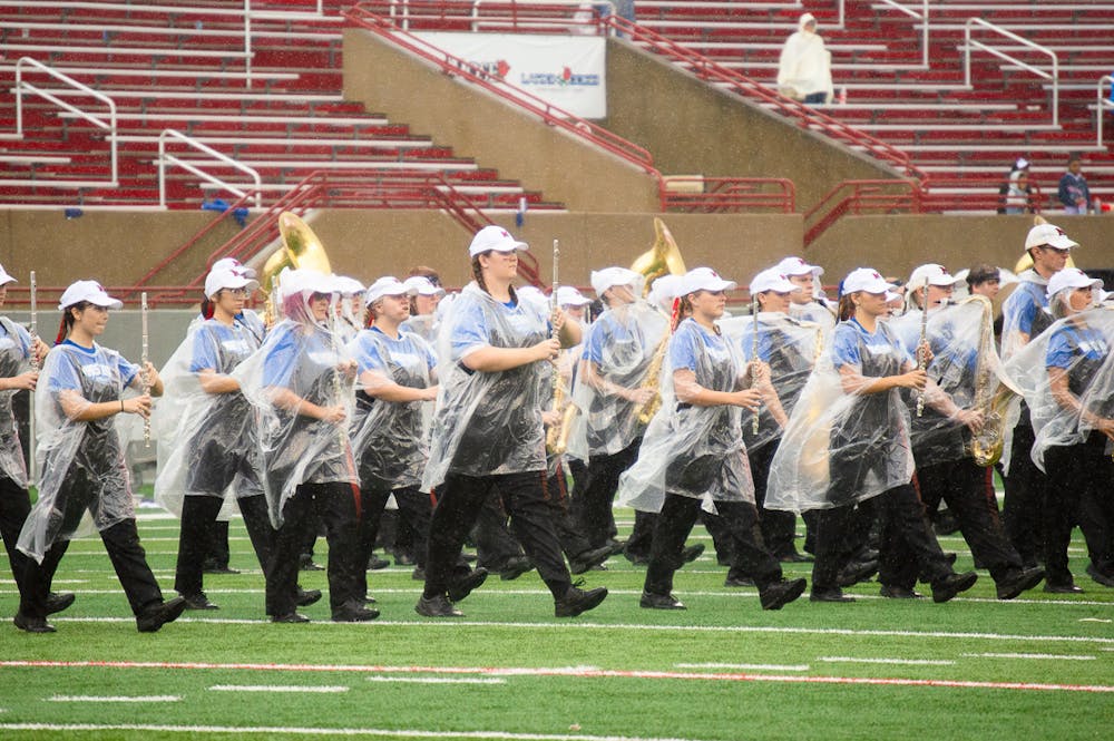 <p>Even within the sea of band members, first-year student Claire finds a way to stand out on the field.﻿ Photo from The Miami Student Archives﻿.</p>