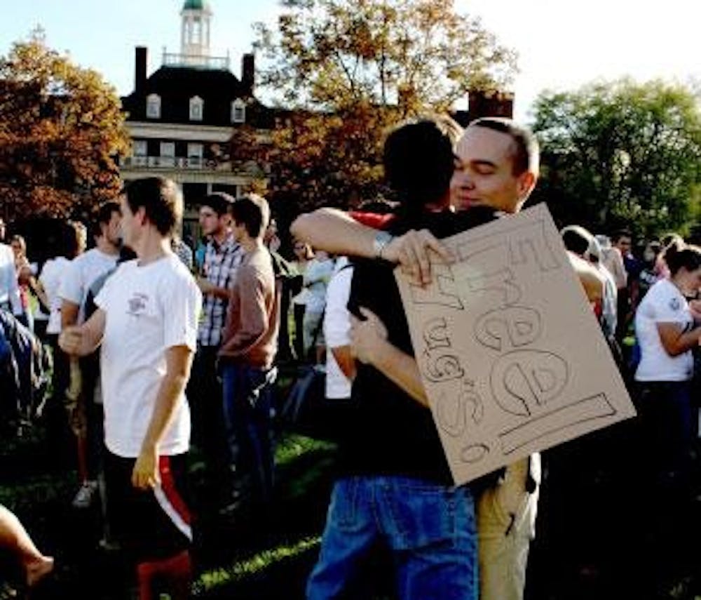 Students react peacefully to the WBC picket by giving out free hugs on Central Quad.