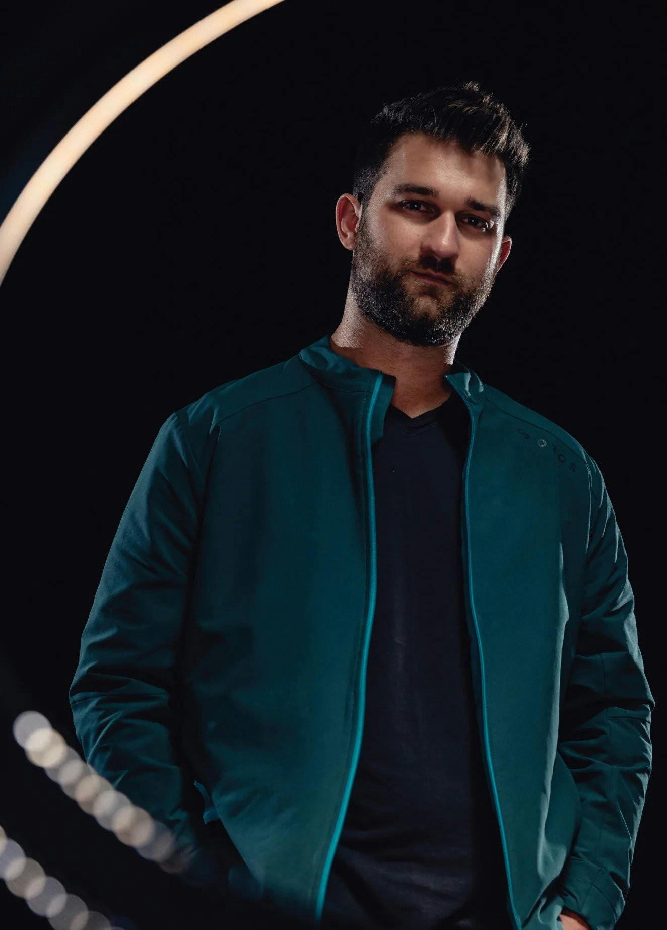 Michael Markesbery, co-founder of OROS, poses in his merchandise.