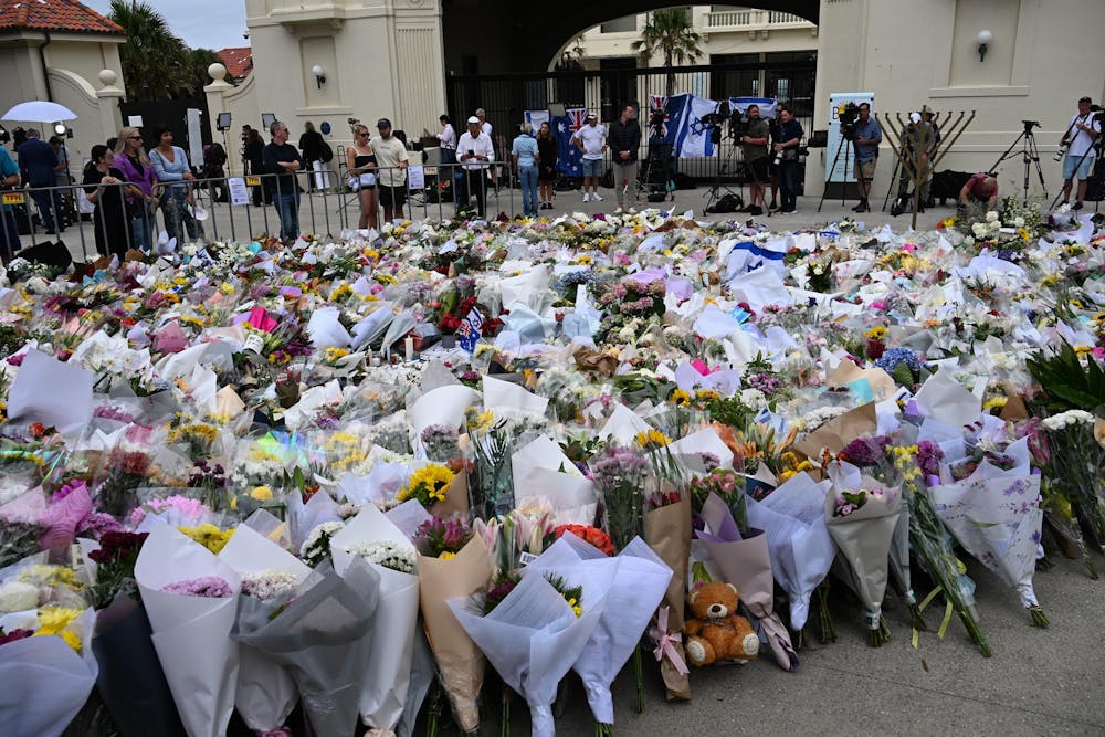 Flowers placed at Bondi Beach, Sydney, after a 2025 shooting at a Hanukkah celebration. Photo from Wikimedia Commons