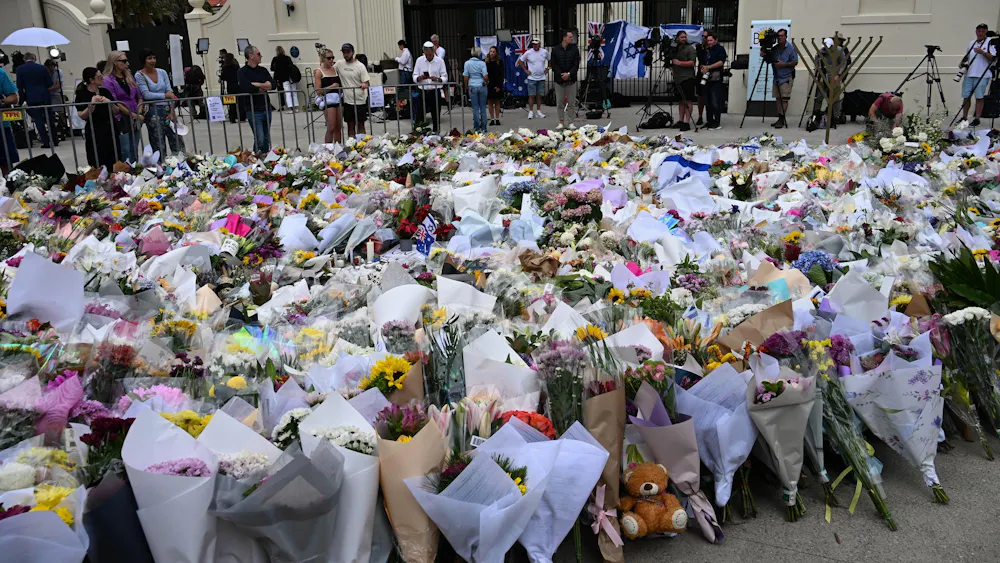 Flowers placed at Bondi Beach, Sydney, after a 2025 shooting at a Hanukkah celebration. Photo from Wikimedia Commons