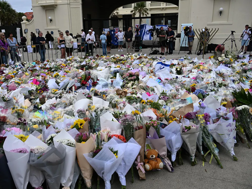 Flowers placed at Bondi Beach, Sydney, after a 2025 shooting at a Hanukkah celebration. Photo from Wikimedia Commons