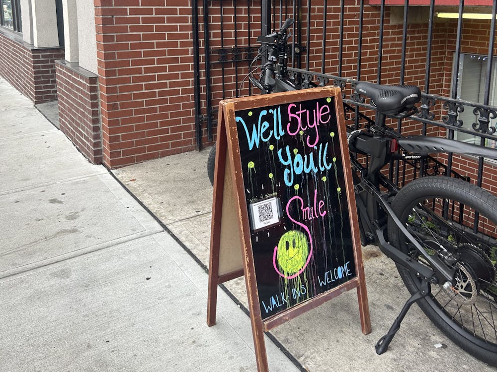 Salon Signature draws customers in with its chalkboard sign.