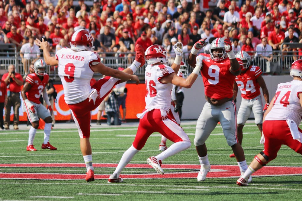 <p>Redshirt senior punter Kyle Kramer punts the ball away during Miami&#x27;s 76-5 loss to Ohio State Sept. 21, 2019, at Ohio Stadium.</p>