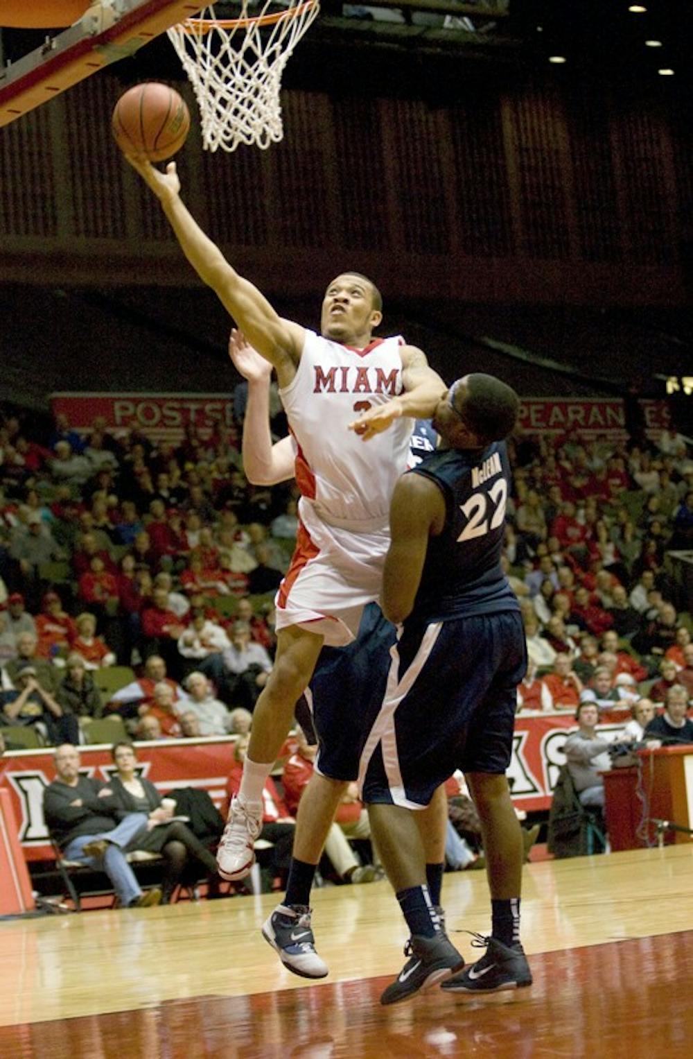 Sophomore guard Allen Roberts goes for a layup during the game versus Xavier University on Tuesday at Millett Hall.