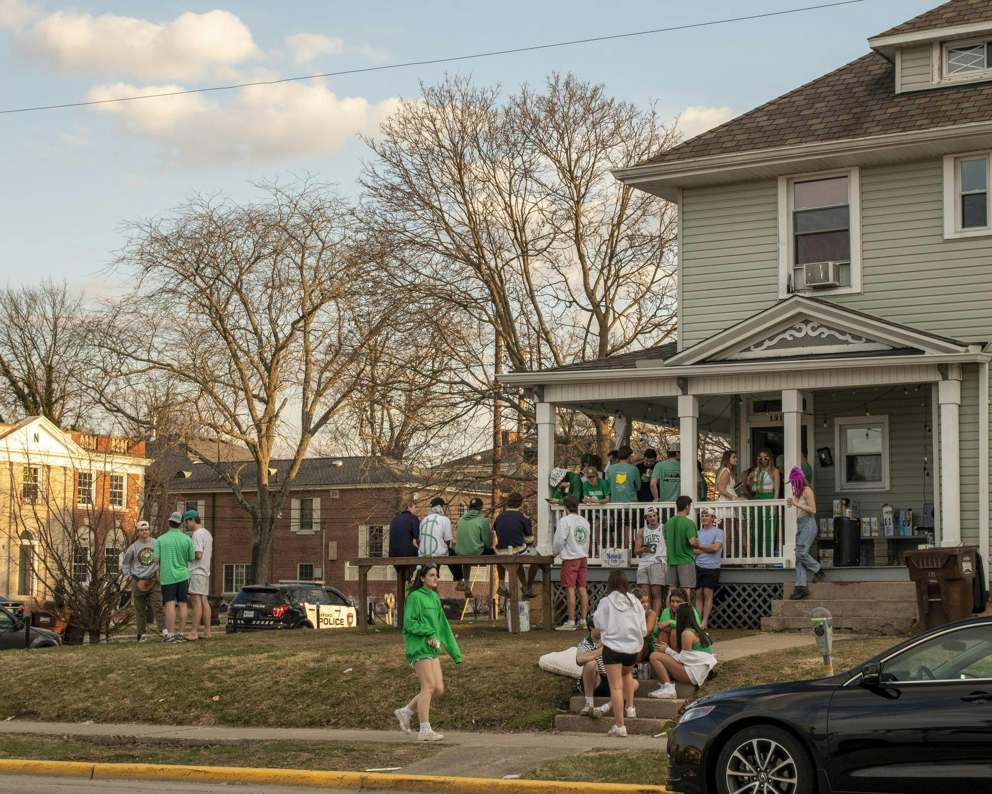 Miami University students attend an off-campus house party on Green Beer Day.