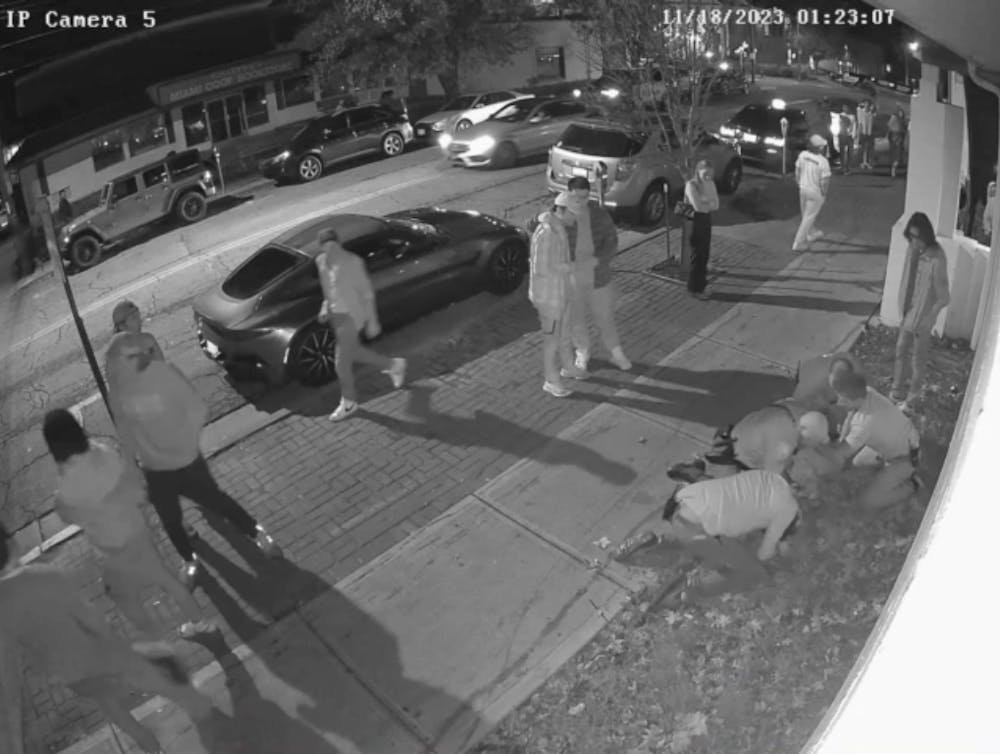 <p>A surveillance camera outside Brick Street Bar shows an Oxford police officer using force to restrain a Miami University student.﻿</p>
