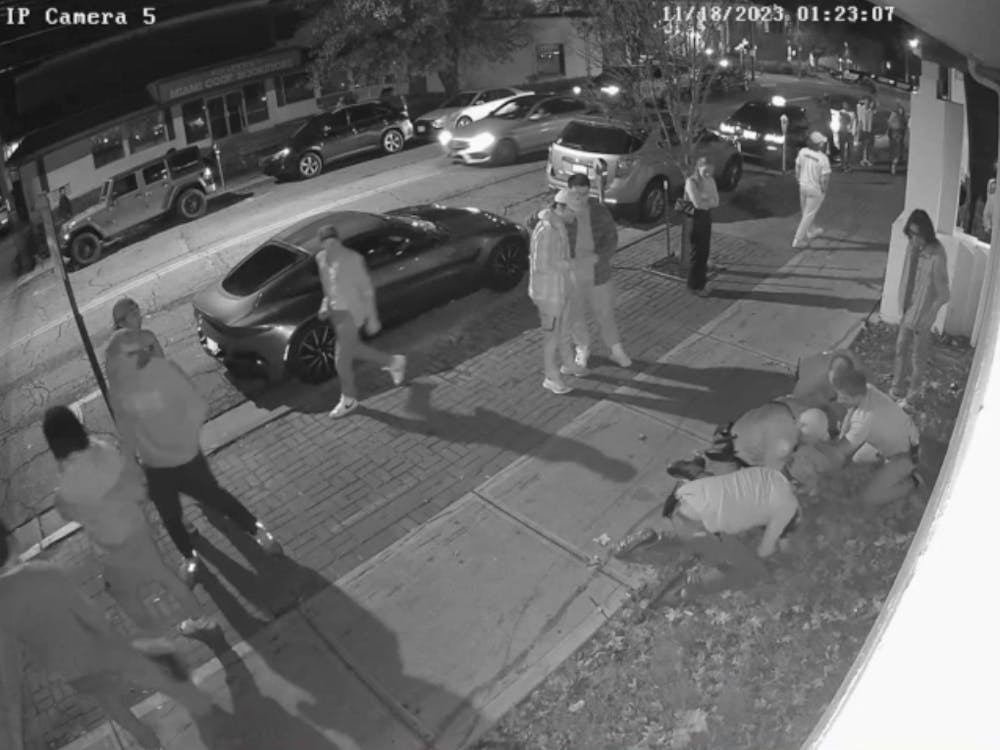 A surveillance camera outside Brick Street Bar shows an Oxford police officer using force to restrain a Miami University student.﻿