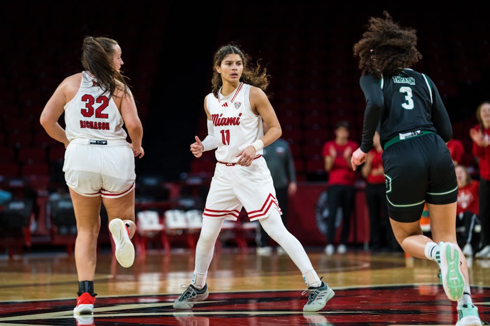 Senior forward Katey Richason (left) and sophomore guard Enjulina Gonzalez (middle) at Millett Hall against Eastern Michigan on Feb. 5