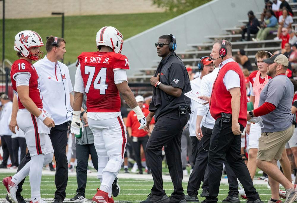 Coach Brunson talks to his players during the September 12.