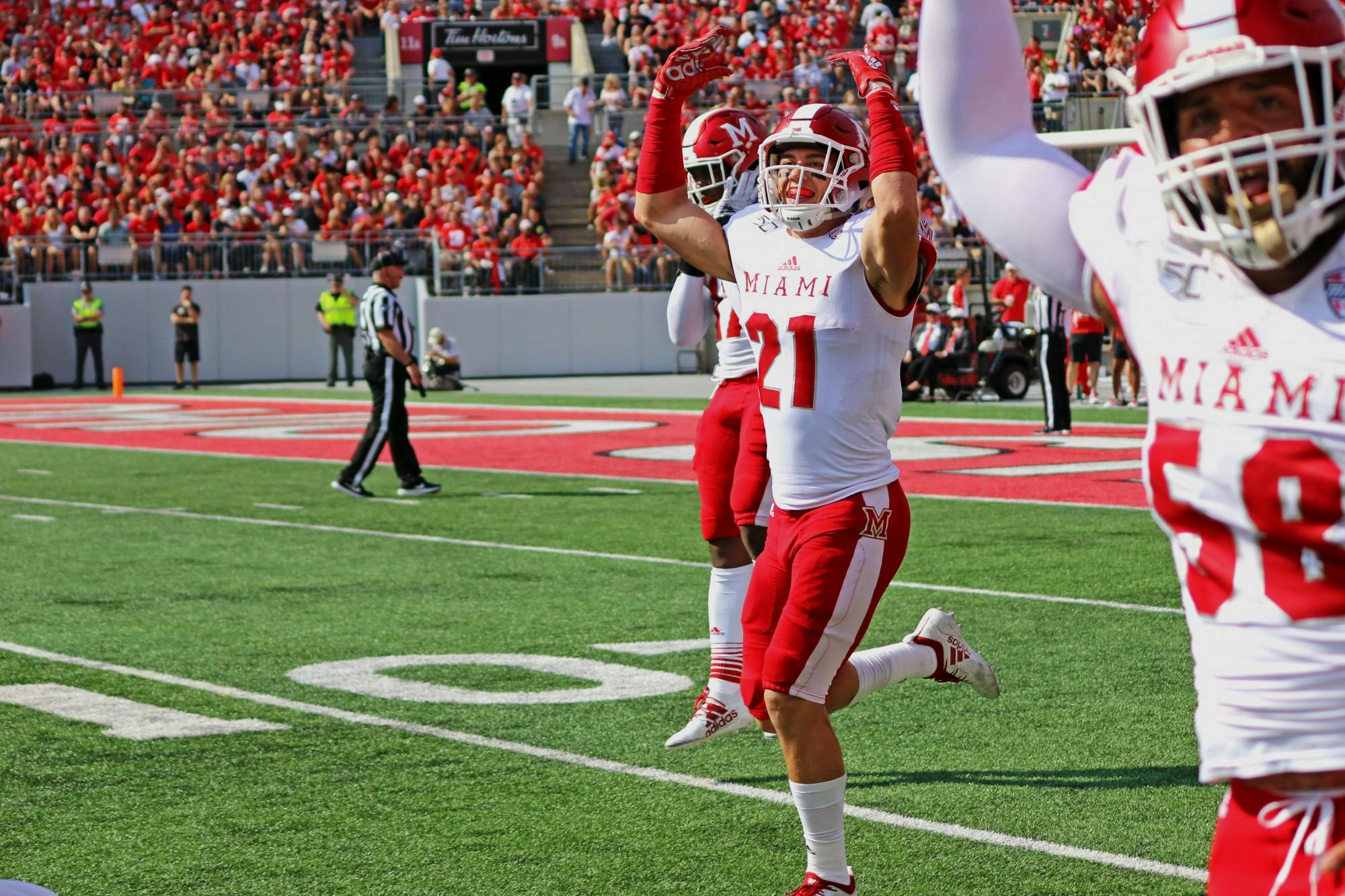 Redshirt sophomore safety Sterling Weatherford and senior defensive lineman Doug Costin celebrate during a 76-5 loss Sept. 21at Ohio Stadium.