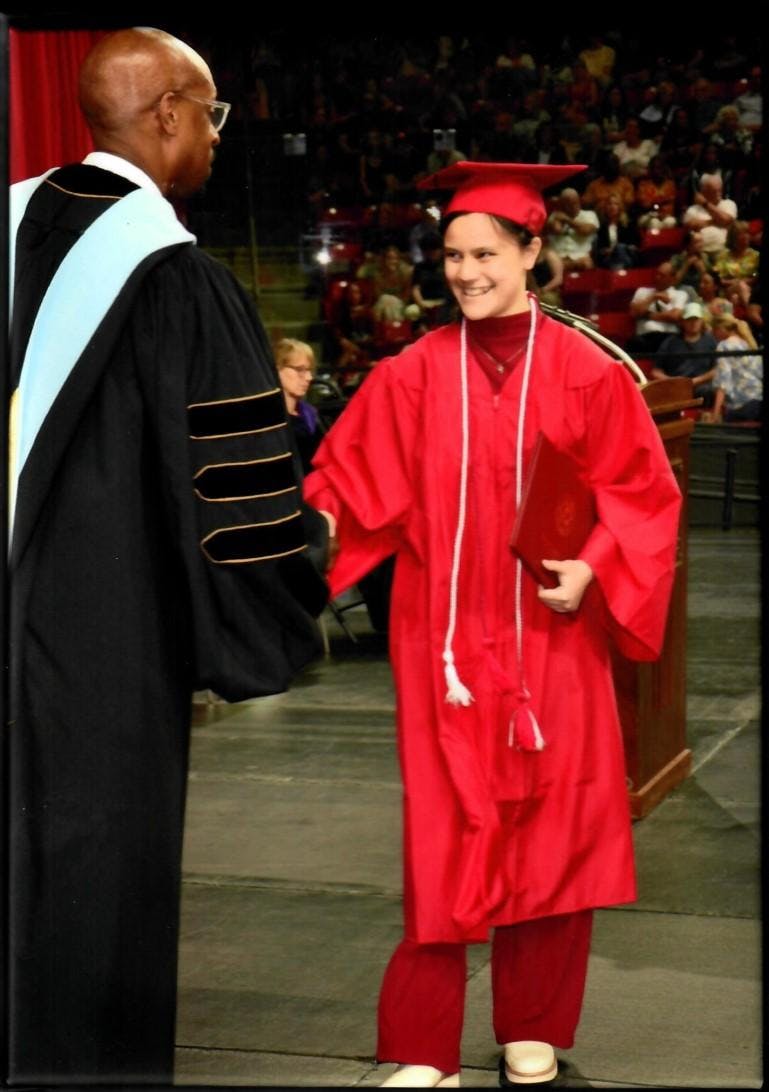 Maureen Wilson walks across the stage and receives an associate's degree from Miami Regionals, Middletown. Photo provided by Maureen Wilson.