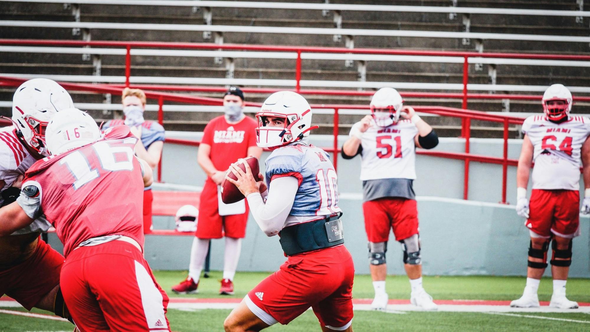 Miami football players are just like everyone else- they need to wear masks, too.