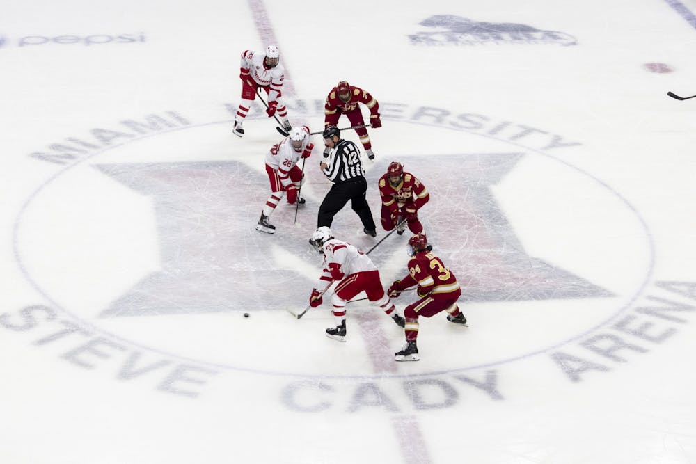 <p>Junior forward Ryan Savage (pictured, bottom left) goes after the puck after an opening faceoff in Miami&#x27;s home series vs. Denver.</p>