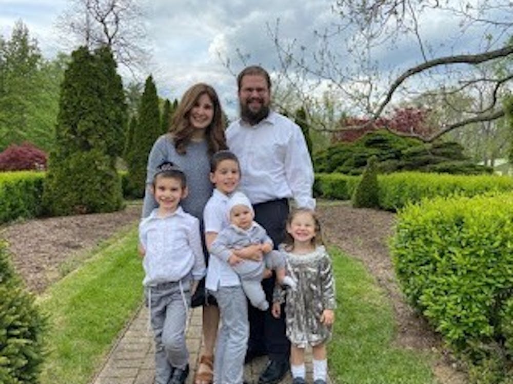 Chabad's rabbi Yossi Greenberg lives below a group of Miami students in an Oxford apartment.