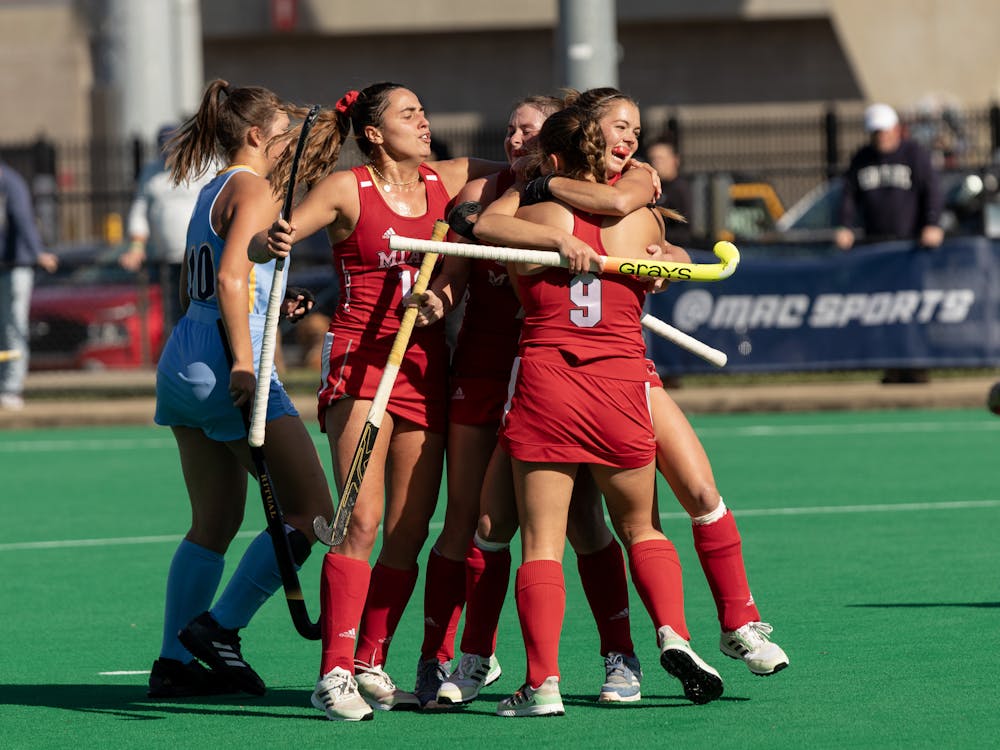 The team celebrates junior striker Reese Wearren's goal that put Miami on the board. The RedHawks never gave up their lead, prevailing 3-1 and making themselves MAC champions.