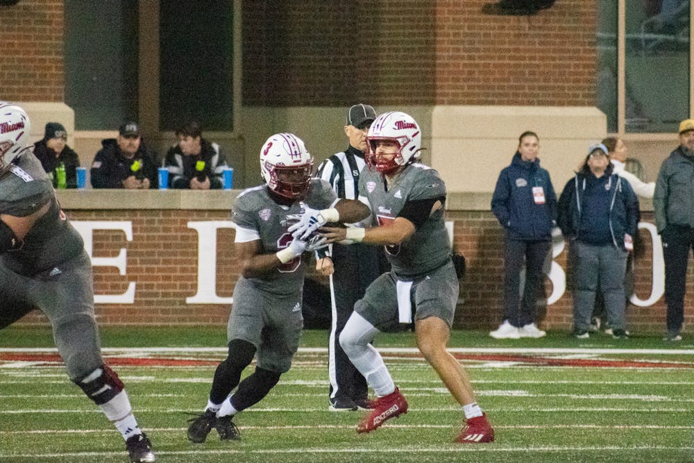 Keyon Mozee taking a handoff from Brett Gabbert. Mozee finished the night with 198 yards and one touchdown