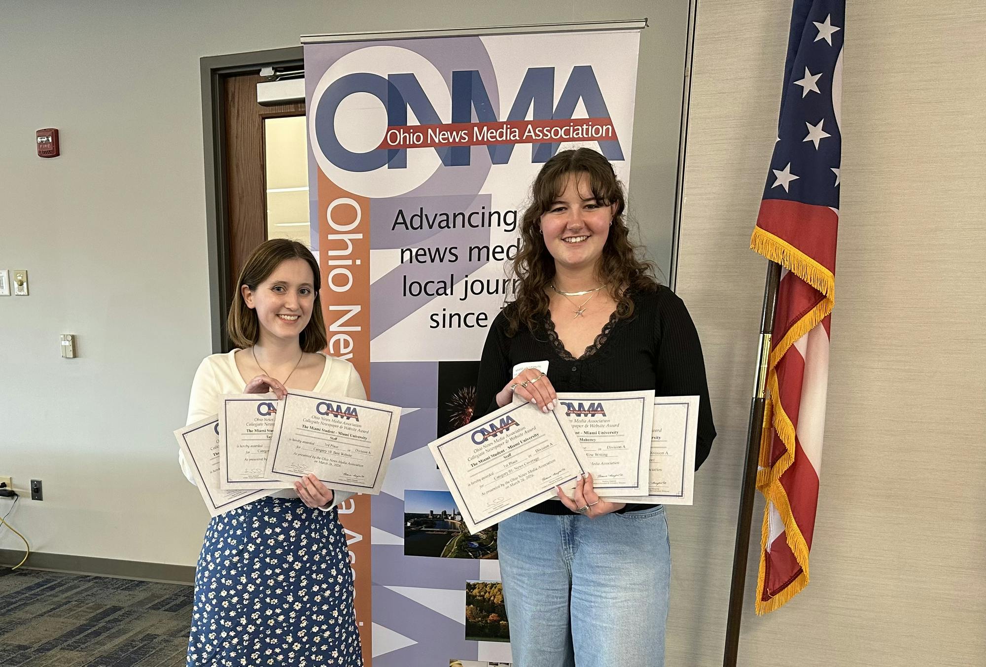 Shannon Mahoney and Taylor Powers accept awards on behalf of The Miami Student
