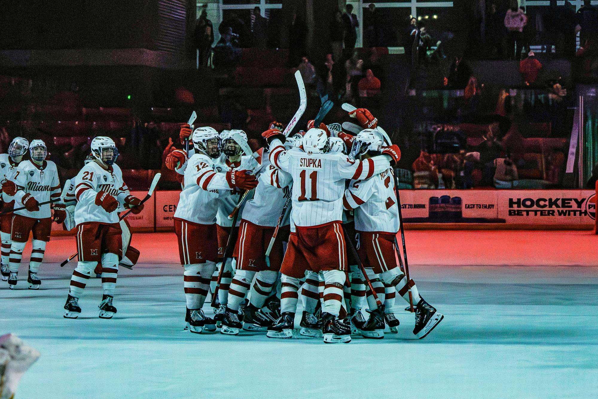 Miami Hockey team celebrates tied game against Colorado College.