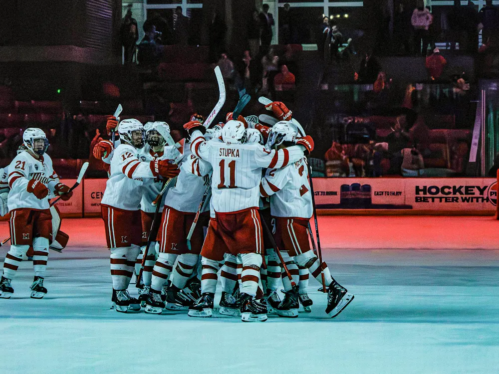 Miami Hockey team celebrates tied game against Colorado College.