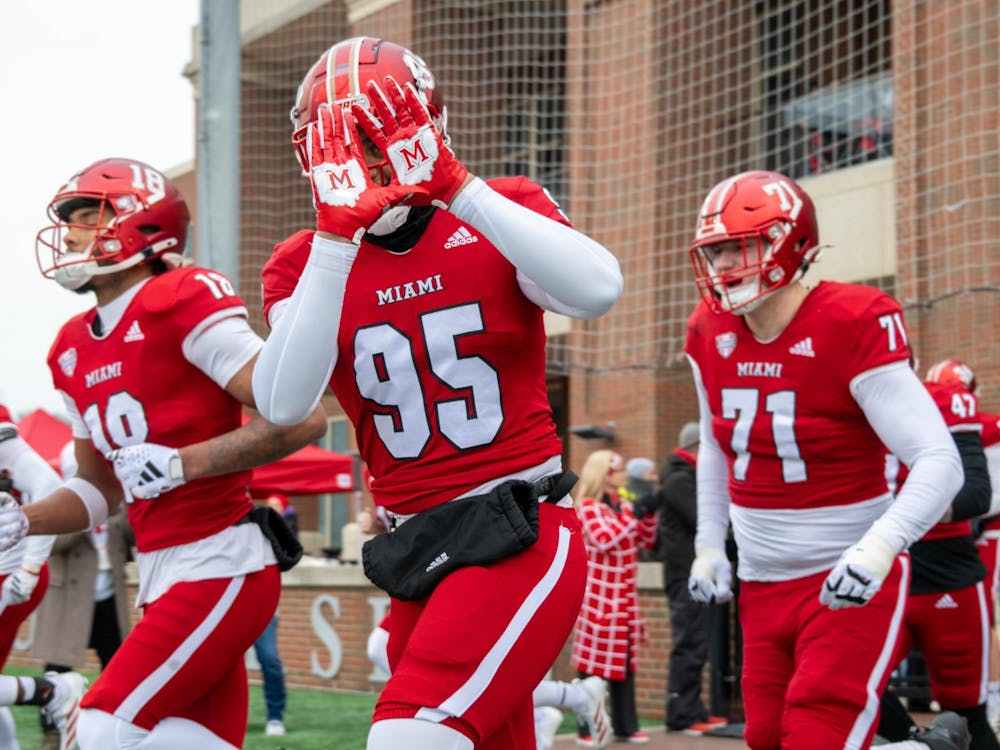 The Miami RedHawks football team runs out at Yager Stadium for the Ball State game on Nov. 29