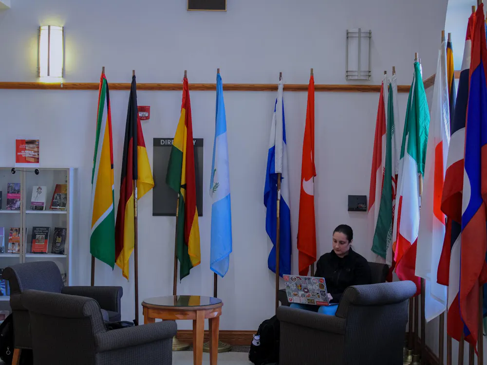 Miami University student studying in the MacMillan Hall lobby.