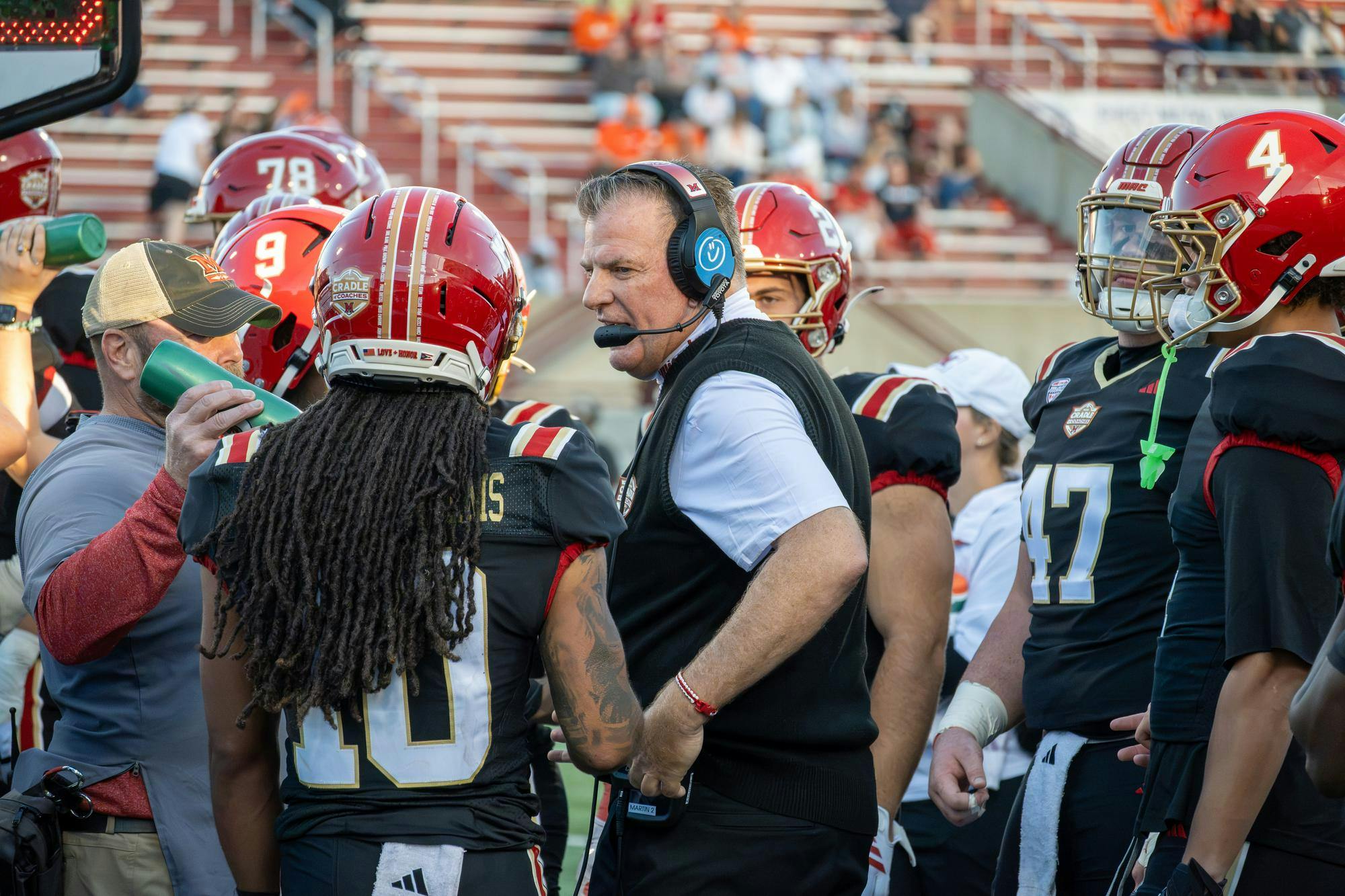 Head coach Chuck Martin talks to his team during game against Bowling Green State University. 