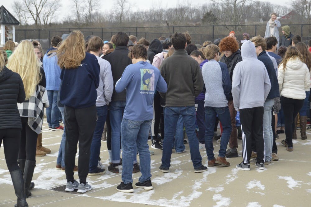 Students gather outside Talawanda High School to speak up about gun violence at schools. 