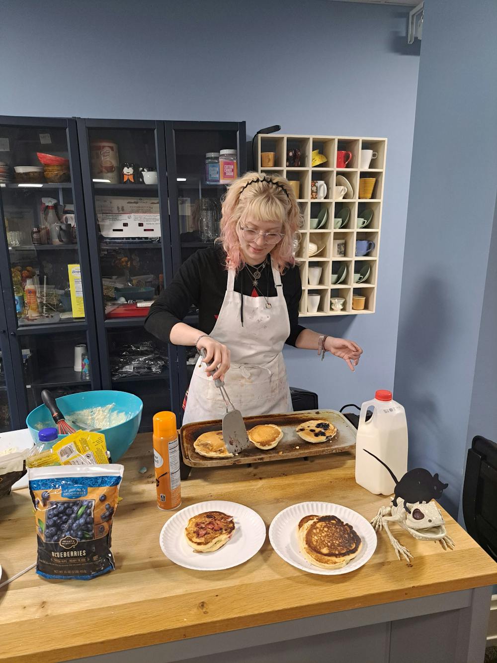 Author Gina Roth makes pancakes at her job in the Western Center, which holds the independent studies major. Photo provided by Gina Roth