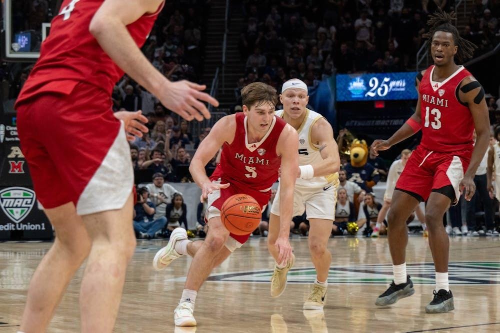 Peter Suder drives for the rim against Akron at the 2025 MAC championship in Cleveland