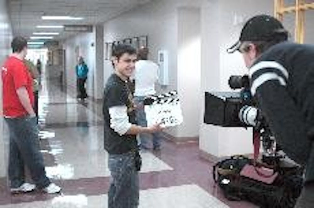 Junior Dan Battistone and Miami alumnus Stephen Murray act as first assistant cameraman and director 