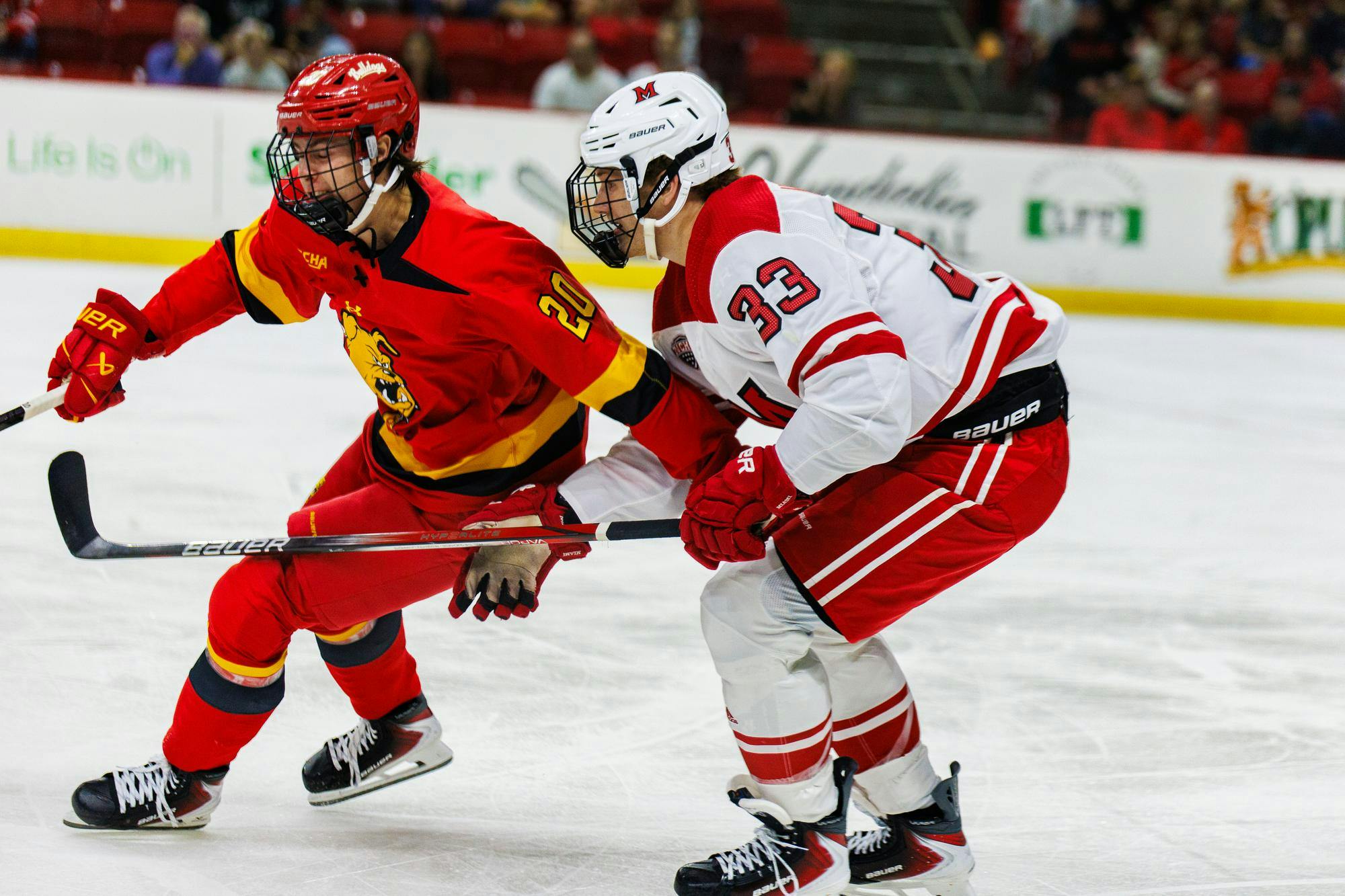 Sophomore forward Casper Nassen lines up against Ferris State junior forward Tanner Rowe at Goggin Ice Center on Oct. 4
