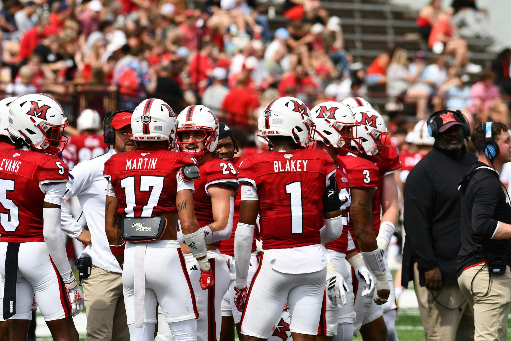 Miami's defense huddles together before UNLV's next offensive snap in the second quarter at Yager Stadium on Sept. 20