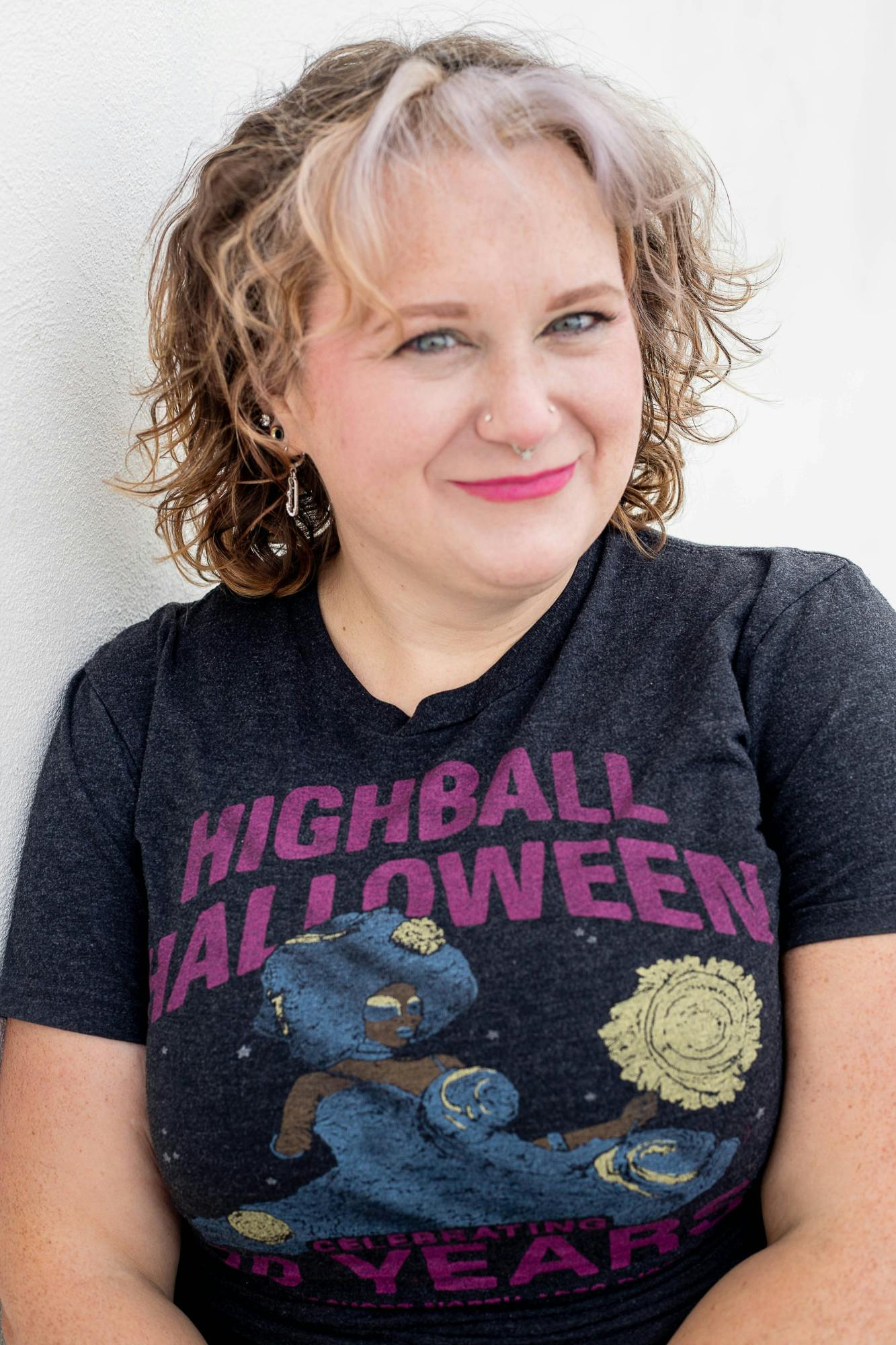 Houf poses in a shirt from one of her favorite costume design competitions.