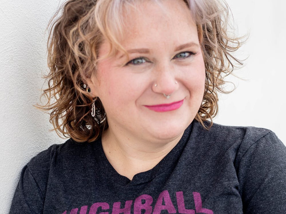 Houf poses in a shirt from one of her favorite costume design competitions.